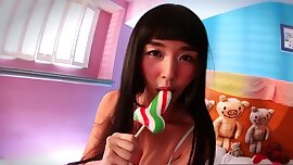 Asian porn star plays with a candy cock